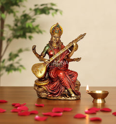 Resin Mata Saraswati idol with veena, ornate crown, red and green draped attire, 6 in