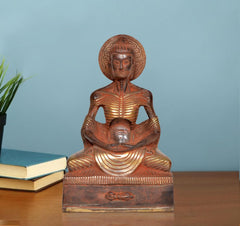 Brass Buddha idol seated with hands in lap and circular halo; 9-inch statue.