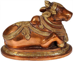 Brass Nandi figurine side view with ornate saddle and tail detail