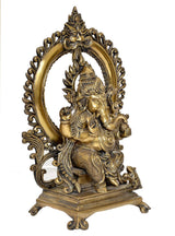 Natural brass Ganesha idol on throne, other side angle with ornate halo