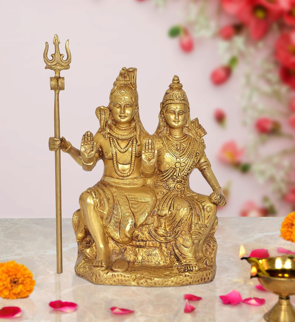 Brass Shiva and Parvati seated showpiece with trident, ornate detailing