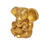 Brass Ganesha idol statue, side view with engraved patterns and raised hands
