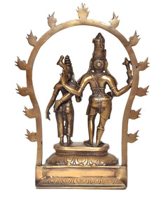Gold-tone Shiva and Parvati idol showpiece with raised arched frame