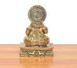 Brass Kuber figurine (6 in), rear view with ornate circular halo and patterned outfit