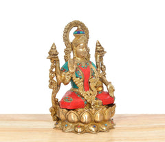 Lakshmi brass statue three-quarter view, gold details, multicolor jeweled clothing