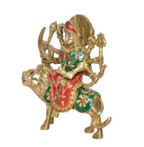Durga Maa brass idol on lion, green-red attire with floral accents, profile view