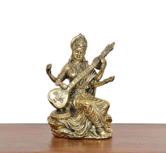 Brass Maa Saraswati statue seated with veena held upright, golden lotus base