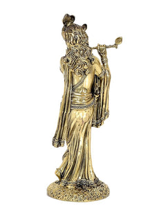 Back view of brass Lord Krishna statue with flute raised and flowing robe detailing