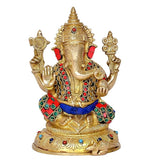 Brass Ganesha statue with four arms, jeweled detailing on crown and garments, 8 inch.