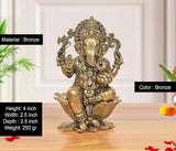 Bronze Ganapati Bappa statue on lotus base; raised hands and beaded ornaments
