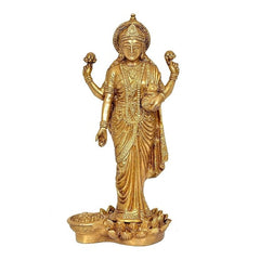 Lakshmi brass standing idol with raised hands, detailed jewelry and draped sari base