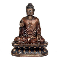 Seated Buddha idol sculpture with raised right hand and ornate blue-gold pedestal