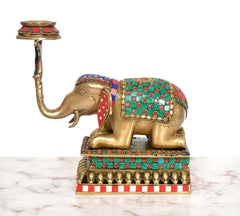 Brass elephant candle stand lamp, close side angle showing beaded border and striped base