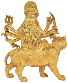 Brass Durga statue on lion, long flowing hair and beard, arms holding ornaments