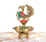 Ornate brass five-diya oil lamp stand with peacock figure and jeweled ring
