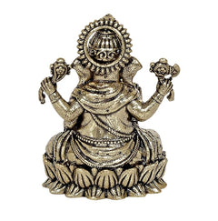 Brass Lord Ganpati murti close-up view, detailed crown and jewelry on lotus base