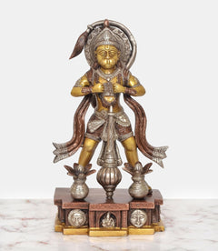 Brass standing Hanuman murti with curved halo, star-like ornaments, and decorated pedestal