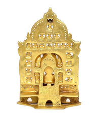 Brass Mahavir Swami statue back view with arched frame and decorative cutouts