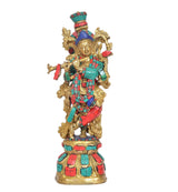 Front view Krishna sculpture with gold details, multicolor ornaments, standing on base