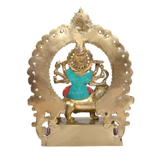 Back view brass Durga Maa statue with multicolor halo and lion figure on pedestal