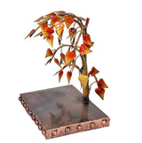 Iron bodhi tree sculpture with leaf canopy and textured rectangular base