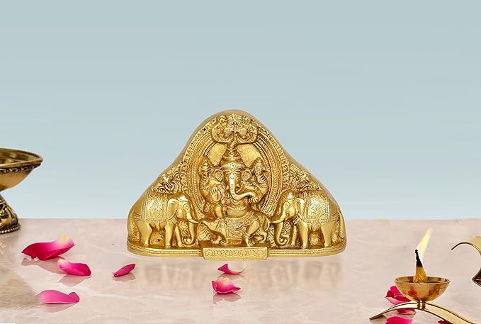 Gold brass Ganesha idol statue with ornate arch and small elephants for table mandir decor