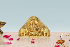 Gold brass Ganesha idol statue with ornate arch and small elephants for table mandir decor