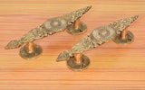 Golden brass door handle set (2), long leaf-shaped backplates with finial tops