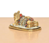 Brass Ganesha relaxing statue, ornate multicolor ringed patterns and gold finish