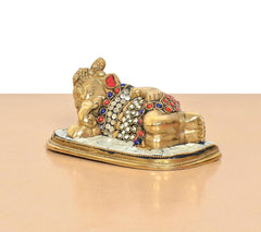 Brass Ganesha relaxing statue, ornate multicolor ringed patterns and gold finish