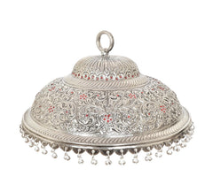 Silver carved chattar with scalloped border, red accents, and hanging bead tassels