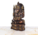 Ganesha brass idol, side angle, seated posture with ornate gold adornments