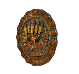 Brass Panchmukhi Ganesha wall hanging, angled view of ornate circular brass relief