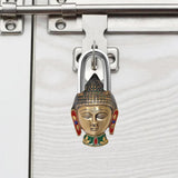 Buddha face door lock in multicolor brass, mounted on metal latch