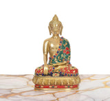 Brass Buddha statue with green robe, red and blue gem accents, seated on pedestal