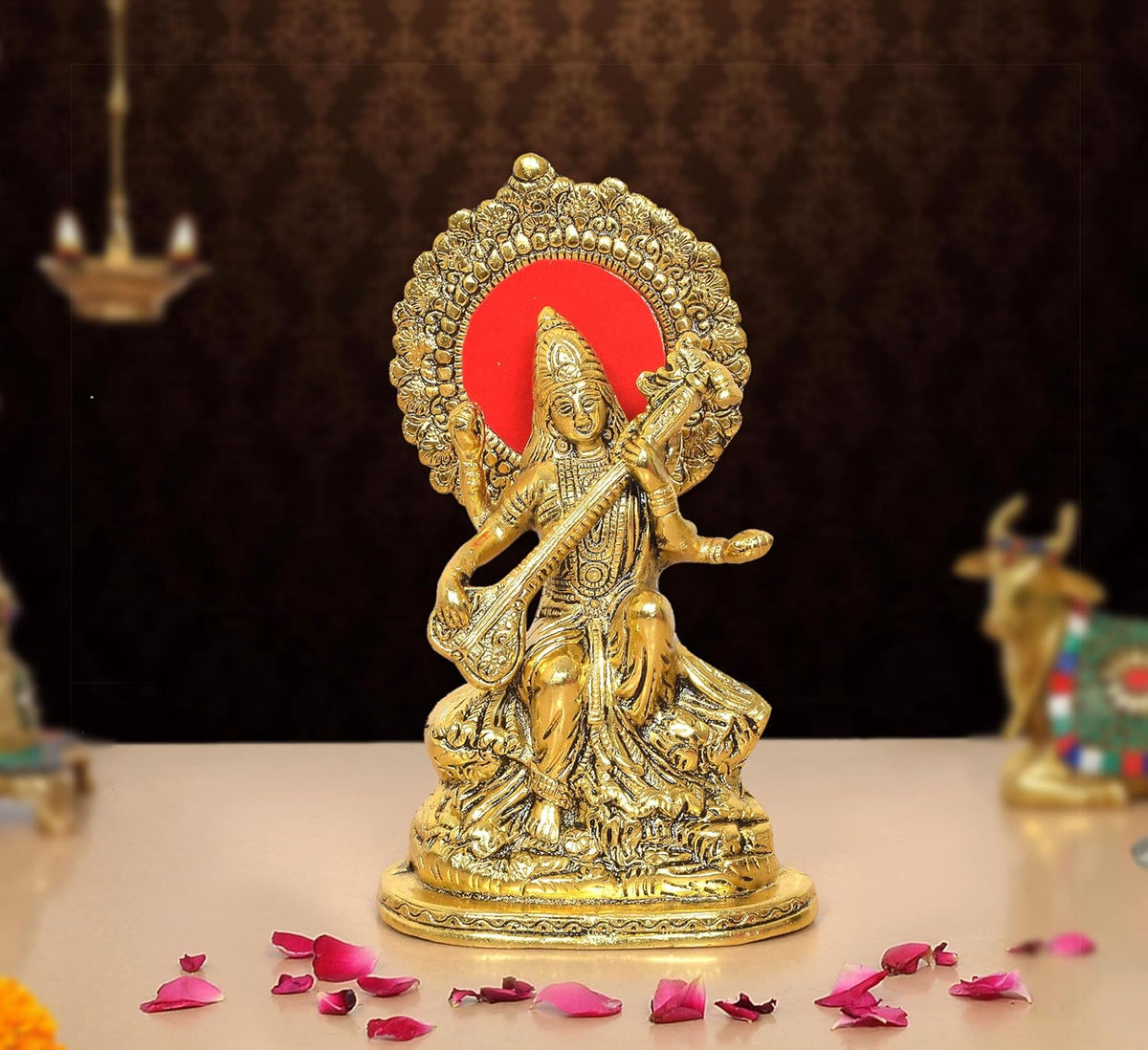 Saraswati Maa seated metal idol, golden tone, red halo, 9 inch height