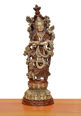 Brass Radha murti, side view with tall crown and textured draped clothing, on pedestal