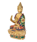 Side view brass Buddha statue with raised hand, jeweled robe, lotus base