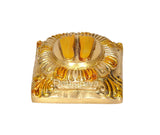 Lakshmi charan paduka brass finish, close-up of lotus-framed footprints