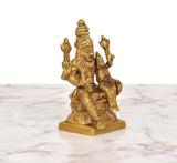Brass Lakshmi-Narasimha idol, rear view with tiered crown and raised hand symbols