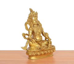 Golden Kuber Bhagwan brass murti, angled view showing back crown and base details