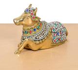 Brass Nandi statue side angle with jeweled multicolor ornamentation on saddle