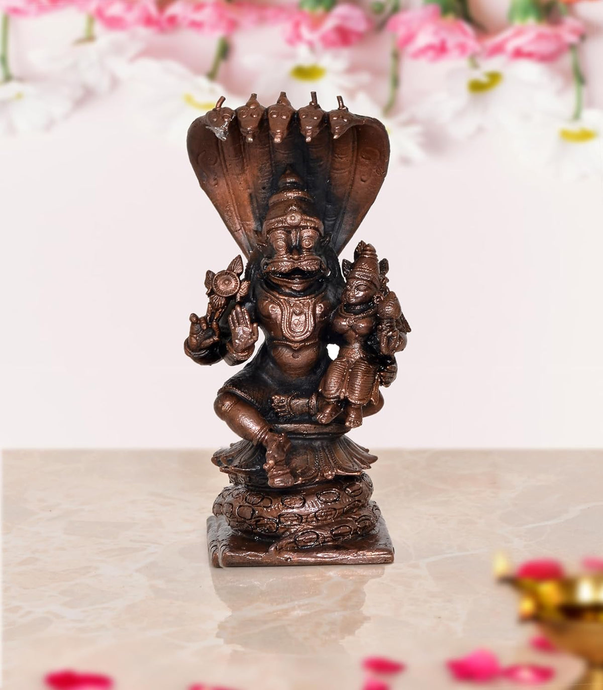 Copper Lakshmi Narasimha figurine, four-armed deity with hooded crown