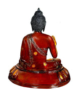 Brass seated Buddha idol, back view with textured hair and draped robe, lotus base
