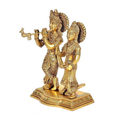 Brass Radha Krishna figurine, side angle showing flute and raised hand