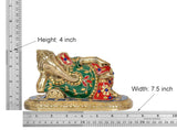 Brass reclining Ganesha statue, height 4 in and width 7.5 in, green/red accents