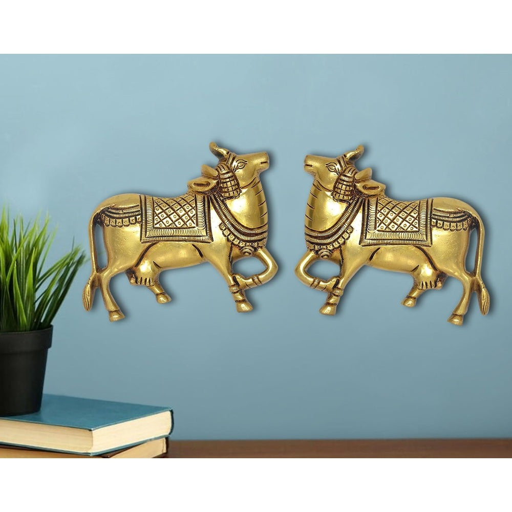 Gold brass Kamdhenu cow pair wall hanging statues, ornate detailing, front view