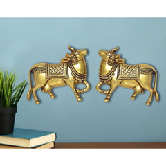 Gold brass Kamdhenu cow pair wall hanging statues, ornate detailing, front view