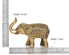 Brass elephant figurine with height 5 in and width 7 in, floral-engraved body