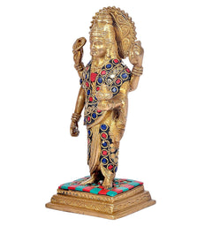 Brass Dhanvantari statue side view on decorated base, colorful inlaid blue and red